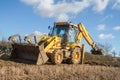 Digger in countryside clearing ditch Royalty Free Stock Photo