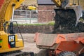 A digger and dump truck move dirt to make room for the foundations Royalty Free Stock Photo