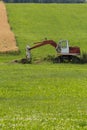 Digger with hut and earth on a corn field rural landscape Royalty Free Stock Photo