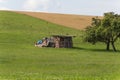 Digger with hut and earth on a corn field rural landscape Royalty Free Stock Photo