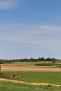 Digger with hut and earth on a corn field rural landscape Royalty Free Stock Photo