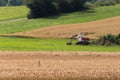 Digger with hut and earth on a corn field rural landscape Royalty Free Stock Photo