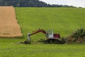 Digger with hut and earth on a corn field rural landscape Royalty Free Stock Photo