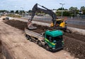 A digger loading a truck with railway spoil Royalty Free Stock Photo