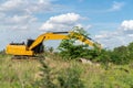 Digger machine digging and adjusting ground level