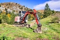 A digger in the mountains Royalty Free Stock Photo