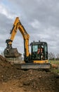 A digger moving soil Royalty Free Stock Photo