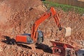 Digger and stone crusher Royalty Free Stock Photo