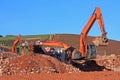 Digger and stone crusher Royalty Free Stock Photo