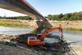 Digger working on the new bridge construction site Royalty Free Stock Photo