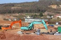 Digger working on a road construction site Royalty Free Stock Photo