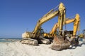 Diggers on beach Royalty Free Stock Photo