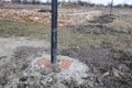Digging holes for fence metal pillars concrete foundation