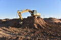 Digging the pit foundation a hole with excavator. Earthwork in excavation and backfilling of soil upto required depth is required Royalty Free Stock Photo