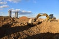 Digging the pit foundation a hole with excavator. Earthwork in excavation and backfilling of soil upto required depth is required Royalty Free Stock Photo