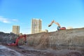 Digging the pit foundation a hole with excavator. Earthwork in excavation and backfilling of soil upto required depth is required Royalty Free Stock Photo