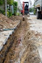 Digging road before install Pipe Water. Excavation water drainage at construction site. Digging roads to lay pipes 8 inches. The r Royalty Free Stock Photo