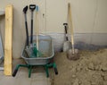 Digging tools. Pile of construction sand Royalty Free Stock Photo