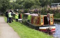 DIGGLE, ENGLAND - Aug 19TH: Waterway officials check boats before escorting them through Standedg tunnel on Royalty Free Stock Photo