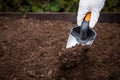 Diging the soil with a garden shovel in human hand. Gardening