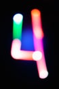 Digit 4. Four. Glowing numbers on dark background. Abstract light painting at night. Creative artistic colorful bokeh. New Year. Royalty Free Stock Photo