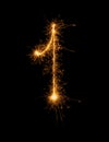 Digit 1 or one made of bengal fire, sparkler fireworks candle isolated on a black background