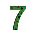 The digit seven, 7 is cut out of white paper on a background of cloth for playing card games with symbols of card suits, casino