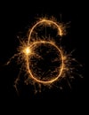 Digit 6 or six made of bengal fire, sparkler fireworks candle isolated on a black background Royalty Free Stock Photo