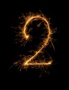 Digit 2 or two made of bengal fire, sparkler fireworks candle isolated on a black background Royalty Free Stock Photo