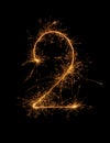 Digit 2 or two made of bengal fire, sparkler fireworks candle isolated on a black background Royalty Free Stock Photo