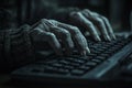 A digital activity is being undertaken by elderly hands that are typing on a black keyboard in a softly lit room Royalty Free Stock Photo