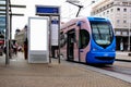 digital ad display at tram stop. blank white lightbox. empty billboard. busstop advertising.