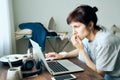 Digital addiction, woman in panic reads articles about coronavirus on Internet