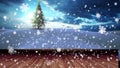 A digital animation of a snowfalling christmas tree in a snowy landscape