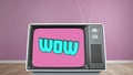 Digital animation of wow text on television scree on wooden surface against purple background