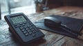 Digital answering machine beside phone on desk office technology professional environment close-up concept Royalty Free Stock Photo