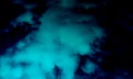 Abstract Sky Blue Smoke In Dark Black Background.Smoke background. Royalty Free Stock Photo