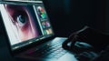 Digital artist working on eye artwork photo editing using laptop at night demonstrating creative process and retouc Royalty Free Stock Photo