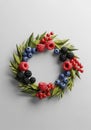 A digital artwork of a wreath composed of vibrant berries and angular green leaves. Royalty Free Stock Photo