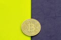 Digital bitcoin on a acid on a purple background. Royalty Free Stock Photo