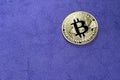 Digital bitcoin on a purple background. Royalty Free Stock Photo