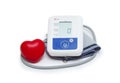 Digital blood pressure meter with love heart symbol on white background Royalty Free Stock Photo