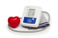 Digital blood pressure meter with love heart symbol on white background Royalty Free Stock Photo