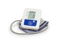 Digital blood pressure meter with love heart symbol on white background Royalty Free Stock Photo