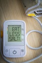 Digital blood pressure monitor with message Royalty Free Stock Photo