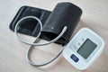 Digital blood pressure monitor on the table, closeup. Helathcare and medical concept