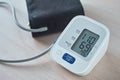 Digital blood pressure monitor on the table, closeup. Helathcare and medical concept