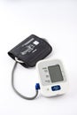 Automatic digital blood pressure monitoring meter on white background Royalty Free Stock Photo