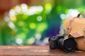 Digital camera and camera bag on an old brown wooden table. Royalty Free Stock Photo