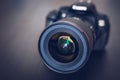 Digital camera or DSLR with camera lens with lense reflections. Royalty Free Stock Photo